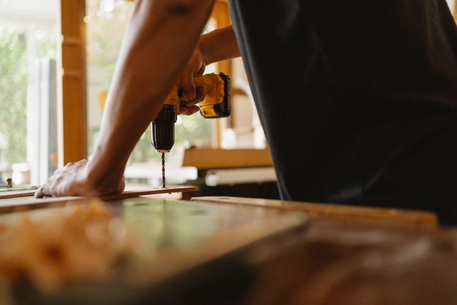 Professional carpenter installing a custom wooden door